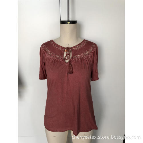 A short-sleeved blouse with tassel cut out